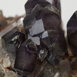 Detail of blocky grey-purple amethyst crystals.