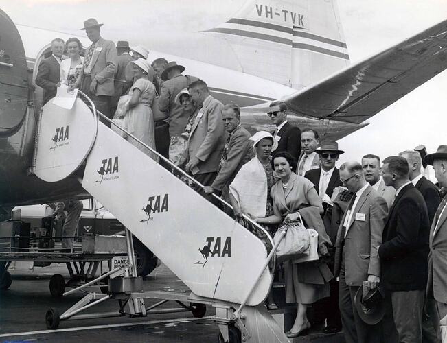 Embarking passengers on steps to aircraft.