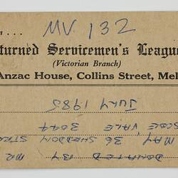 Paper tag on thick brown card stock, with black printed and blue handwritten text.