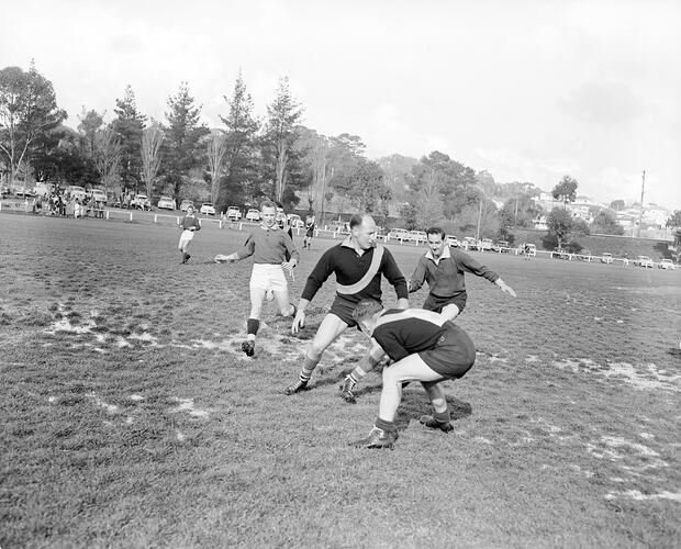 Men Playing Football, Eltham, Victoria, Jul 1958