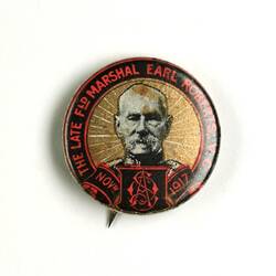 Badge with black and red banner, male head.