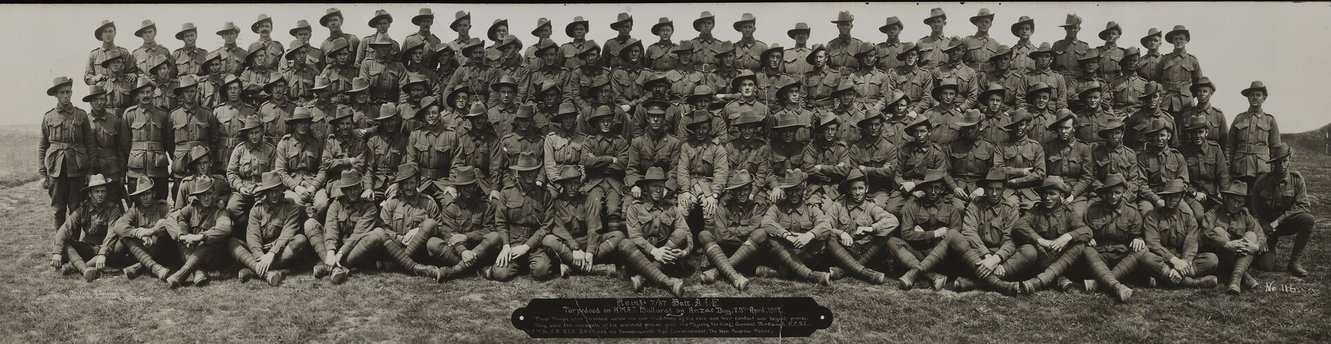 Group portrait of men in military uniform arranged in five rows.