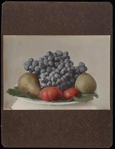 Still life of fruit on a plate.
