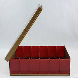 Open metal and plastic box.