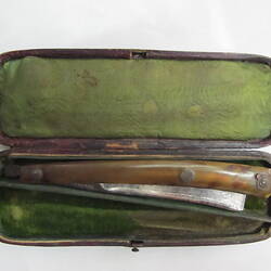 Cut-throat razor in green-lined box