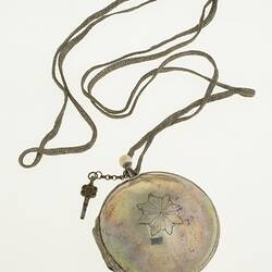 Gentleman's pocket watch in case and attached to silver plaited chain.