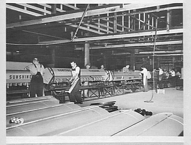 Factory assembly line with workers.
