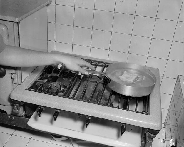 Woman Boiling an Egg in Plastic Packaging, Melbourne, Victoria, 1956