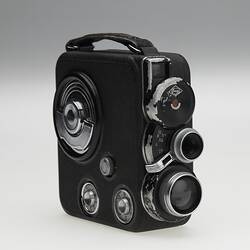 Front view of movie camera with leather handle.