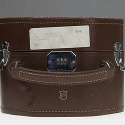 Brown leather case with front handle.