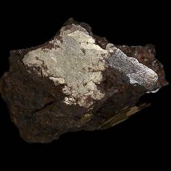 Rock with shiny cut surface.