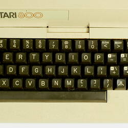 Top view of beige plastic unit with keyboard.