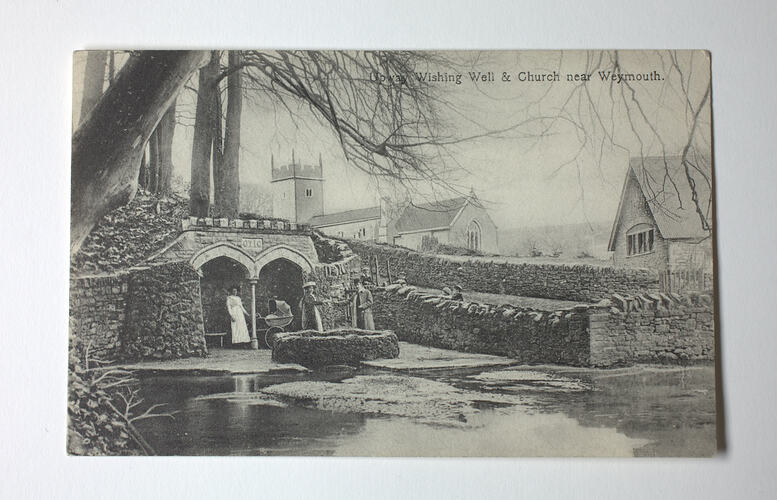 Wishing well, bridge and buildings.