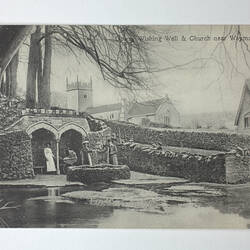 Wishing well, bridge and buildings.