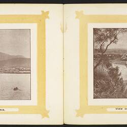 Open booklet, off-white pages. Yellow framed city view with water foreground on left page and river bridge tow