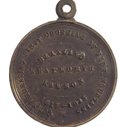 Medal with raised text. Loop at top.