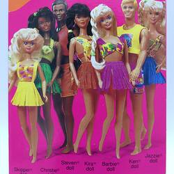 Detail of back of Barbie box. Pink with image of 7 different Barbie dolls.