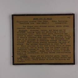 Brown rectangular label with black text and brown border.