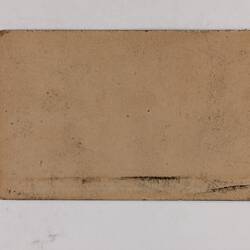 Retangular brown card.