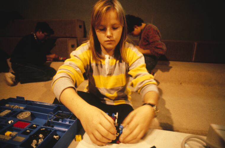 A students playing with Lego.