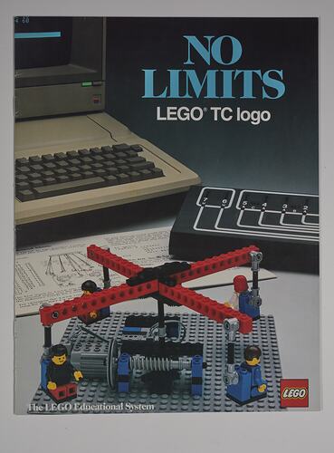 Front cover with red LEGO carousel build at front with four figures. Computer behind. Text above.