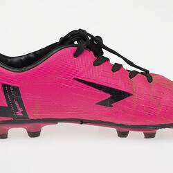 Pink Australian Rules football boot with black bootlace, inner sole and sole.