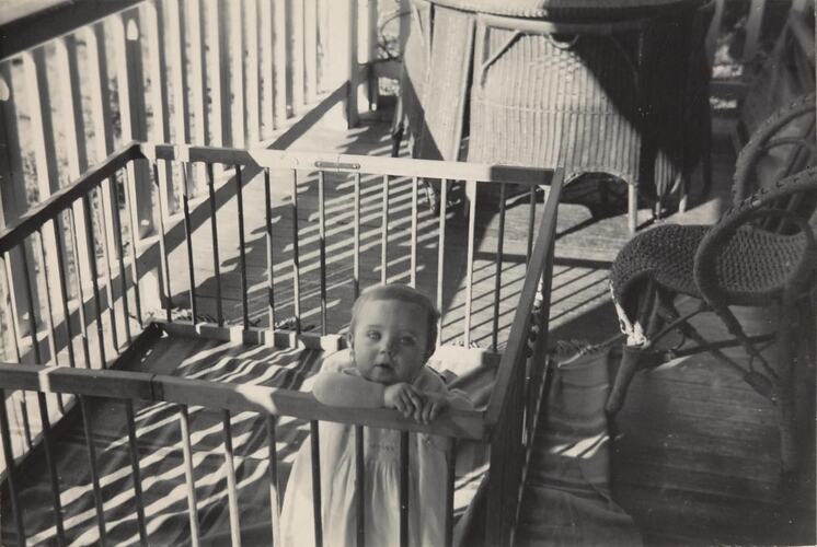 Digital Photograph - Baby in Wooden Play Pen on Front Verandah, Springvale, circa 1954