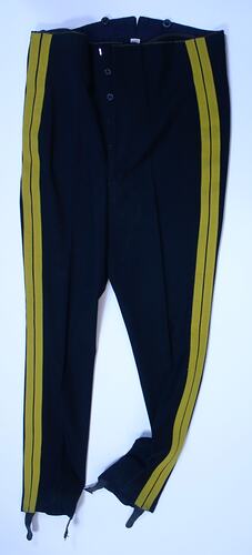 Black trousers with yellow stripe down each leg