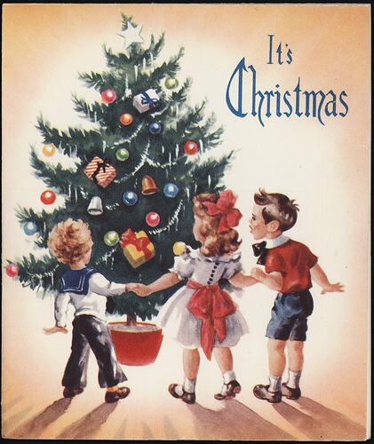 Christmas card with children around a decorated tree.