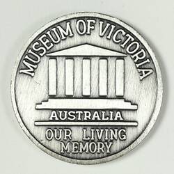 Silver medal with museum building design.