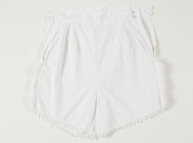 White, lace-trimmed bloomers with fastener buttons at waistband.