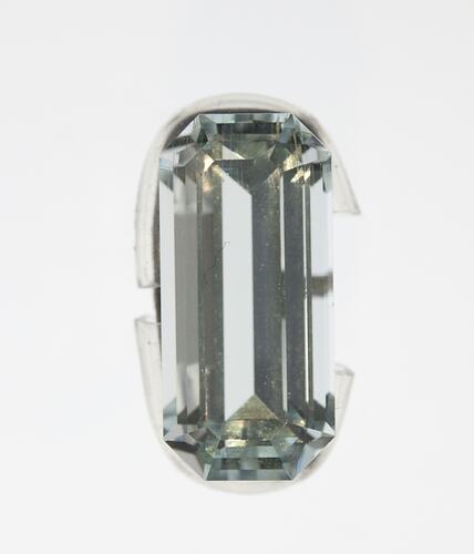 Clear oval faceted gemstone specimen.