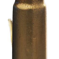 Copper bullet-shaped rifle cartridge with fine tip.