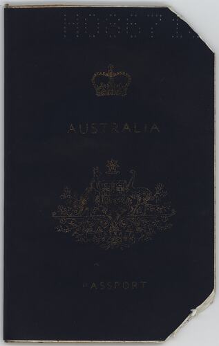 Dark blue passport front cover with gold printing. Logo in centre. Punched letters and numbers along top.