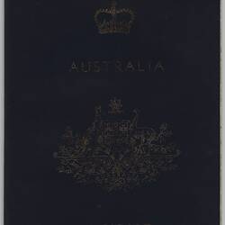 Dark blue passport front cover with gold printing. Logo in centre. Punched letters and numbers along top.