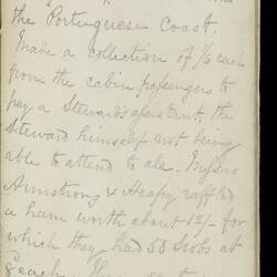 Open diary with handwritten text on discoloured worn page.