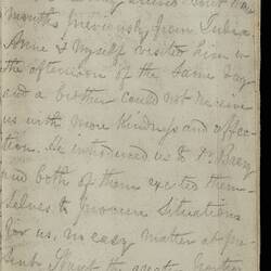 Open diary with handwritten text on discoloured worn page.