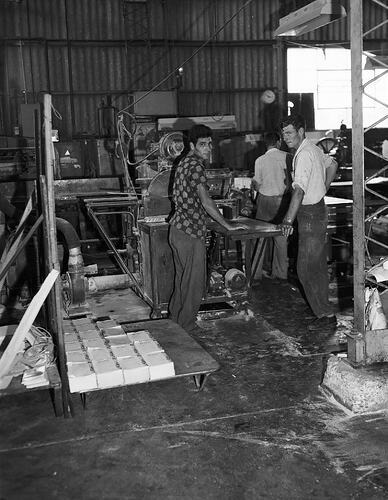 Monochrome photograph of a printing factory.