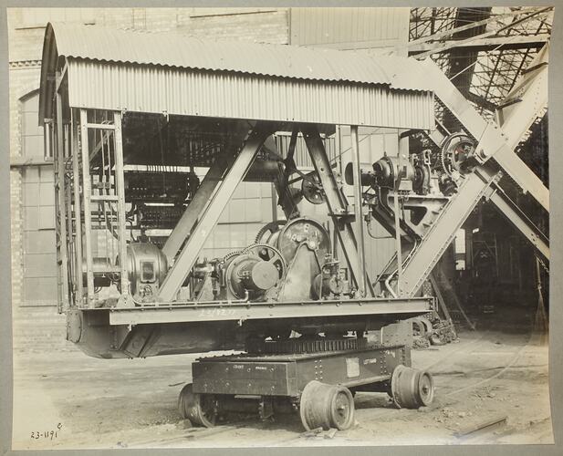 Monochrome photograph of an excavator shovel.