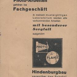 Back of paper folder with printed text.