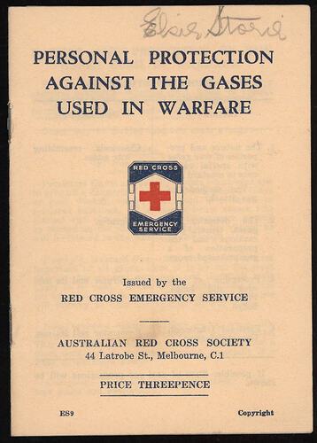 Printed booklet with red cross on cover.