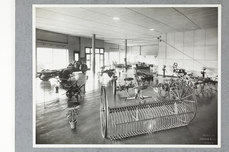 Monochrome photograph of a showroom interior.