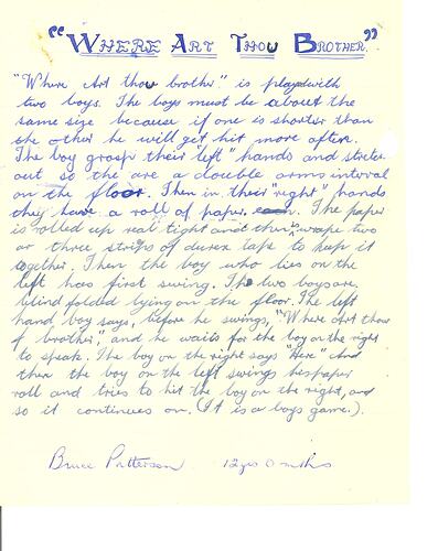 Handwritten game description in two shades of blue ink on paper