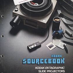 Cover page with photograph of projector on table.