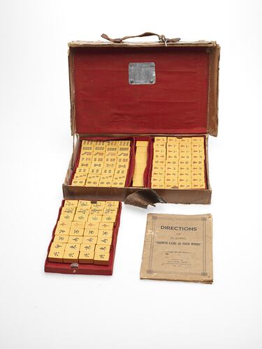 Mahjon set in red cloth lined box.