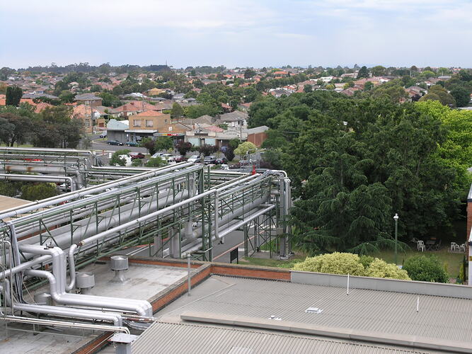 Gantry system on factory rooves in suburb.