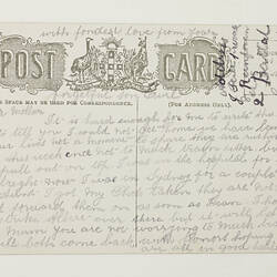 Back of postcard with printing and hand-writing.