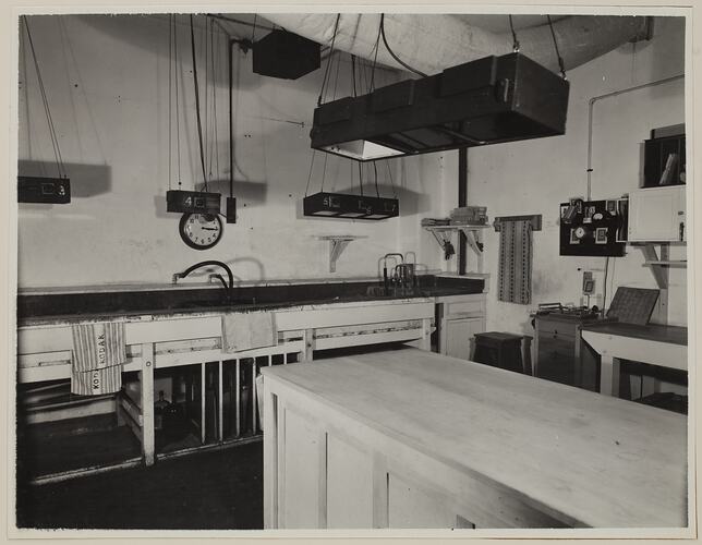 Industrial interior, dominated by work table and sink.