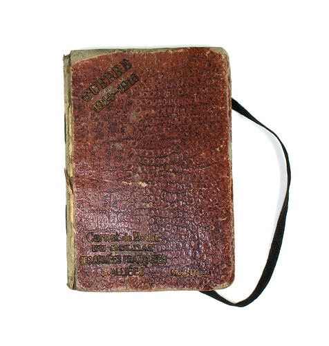 Front cover of diary with elastic strap on right.