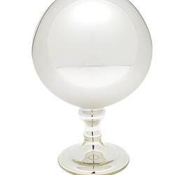 Mirrored glass globe on glass stand.